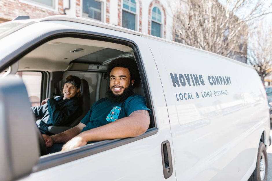 Friendly moving company team members smiling