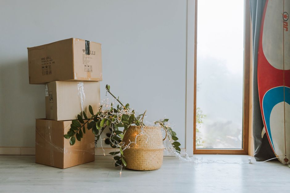 Movers unpacking boxes in a new living room